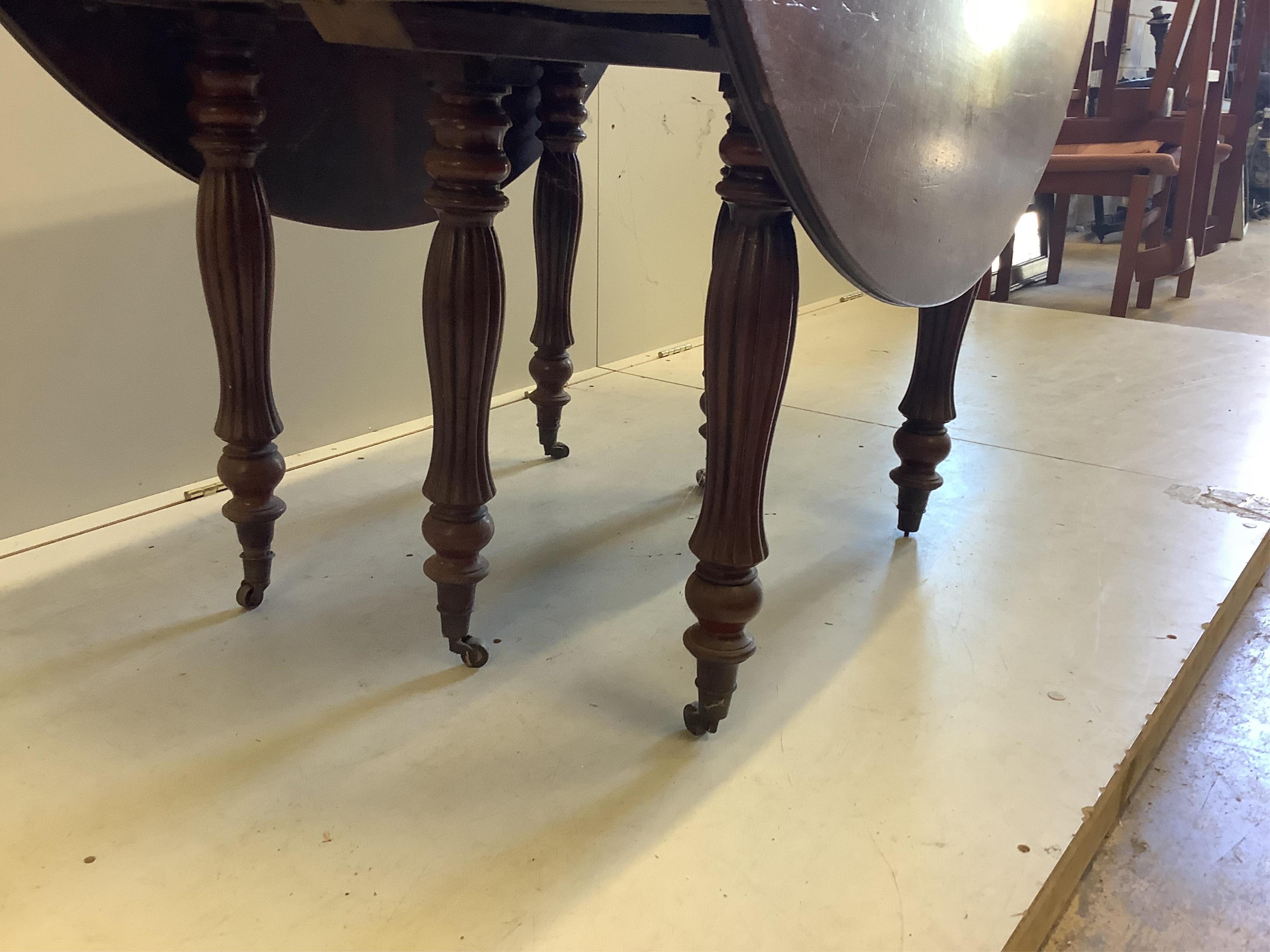 A 19th century Continental mahogany drop leaf extending dining table, no leaves, width 166cm extended, depth 129cm, height 68cm